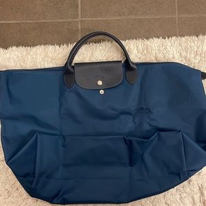 Longchamp LE PLIAGE large travel tote. Looks rich. This  designer gives quality.